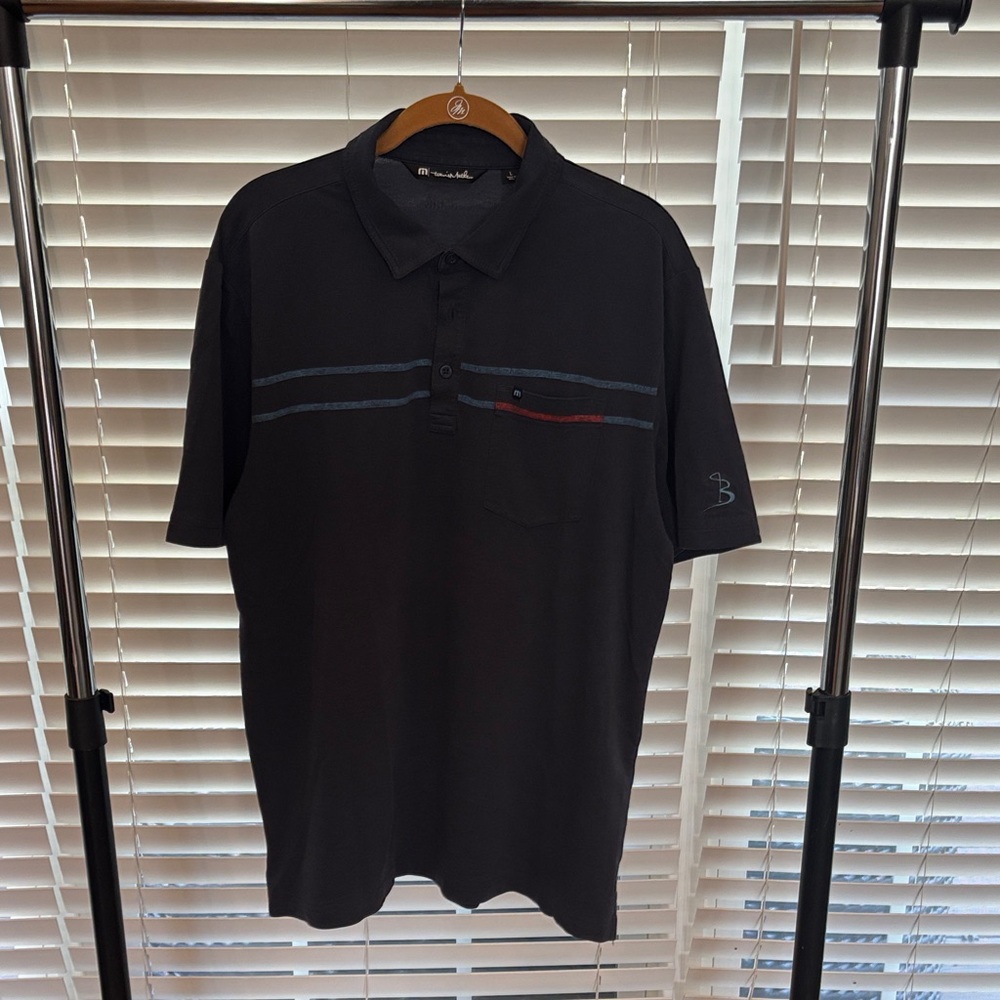 Travis Mathew Polo with Blue and Red Accents